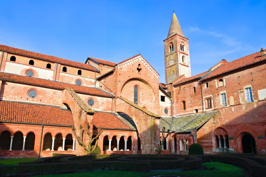 Staffarda, Piedmont, Italy - January 20, 2020: View of the cloister and internal court of the Staffarda abbey, a Cistercian monastery located near Saluzzo, founded in 1135