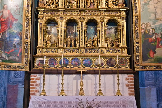 Staffarda, Piedmont, Italy - January 20, 2020: Internal nave and gilded altar of Staffarda Abbey, a Cistercian monastery located near Saluzzo, founded in 1135