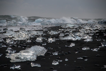 Ice chunks washed up on a black sand beach