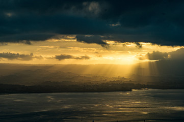 Sun rays through clouds