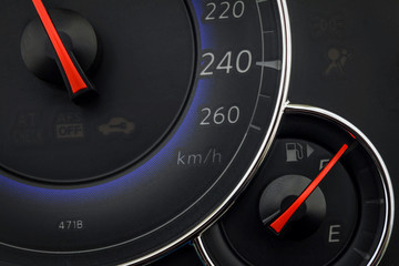 Close up shot of a car speedometer.