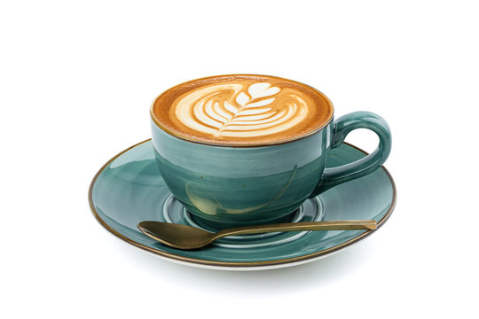 Side view of hot latte coffee with latte art in a vintage ceramic green cup and saucer isolated on white background with clipping path inside. Image stacking techniques.