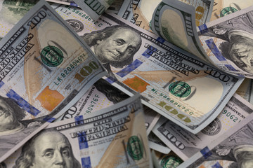 randomly layed 100 dollar bills background