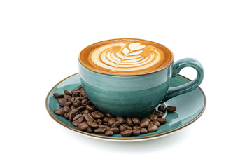 Side view of hot latte coffee with latte art in a vintage ceramic green cup and saucer isolated on white background with clipping path inside. Image stacking techniques.