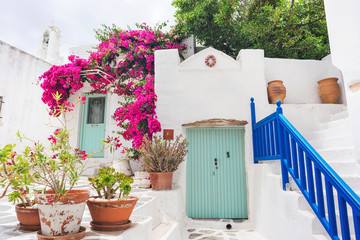 Greece travel landscape, traditional greek house with flowers in Paros island