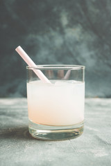 Old fahioned lychee cocktail on the rustic background. Selective focus. Shallow depth of field.