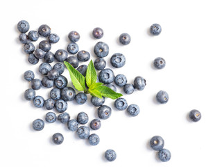 Blueberries with a mint leaf isolated on white. Top view fresh summer berries