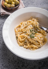 Top  view of Creamy  cheese , olives, Fettucini Alfredo pasta.