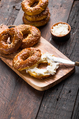 Bagels sandwich with cream cheese on wooden table