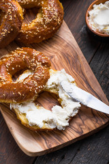 Bagels sandwich with cream cheese on wooden table