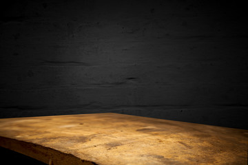 Brown textured background made of twigs, a wooden countertop in front of the background, can be used for production or installation.