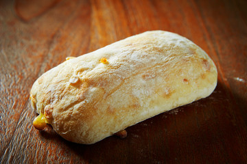 Cheese white bread on wooden background 