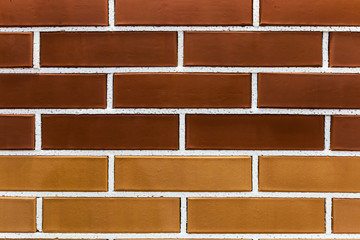 imitation of brickwork from different colors of bricks in a construction store or exhibition. The background of bricks
