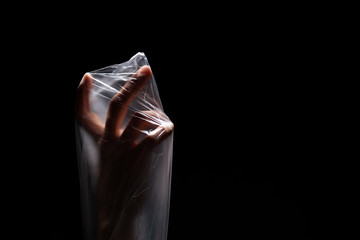 Ecological concept in Earth protection. Plastic bag refusal. Hands in plastic bag. Ban and reducing of plastic in environment