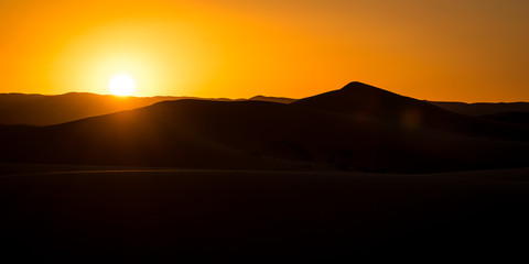 Sunset over sand dunes of Sahara, Merzouga, Morocco