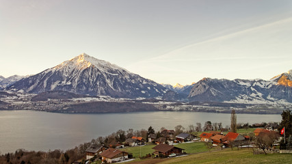 Winter in Swiss Alps mountains near the Thun lake