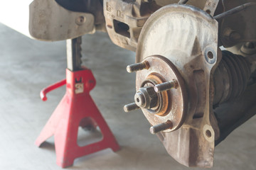 Car disc brake showing dust cover and brake caliper without disc plate, Car service.
