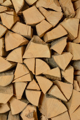 The texture of the wall is firewood, which is laid out very neatly.