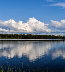 Reflection of clouds in the water of a swedish lake.