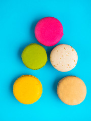 Closeup assortment of lots of multicolored tasty macarons, Christmas tree shape made of tasty macarons