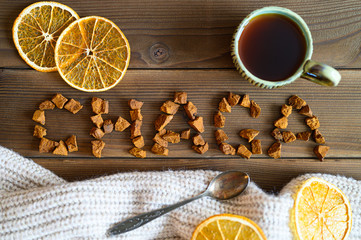 chaga tea mushroom from birch tree using for healing tea or coffee in folk medicine. the word chaga, laid out from pieces of the birch tree mushroom