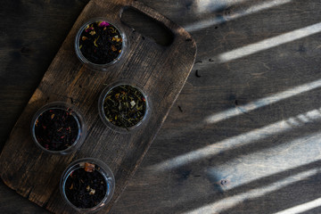 Tea varieties on wooden background