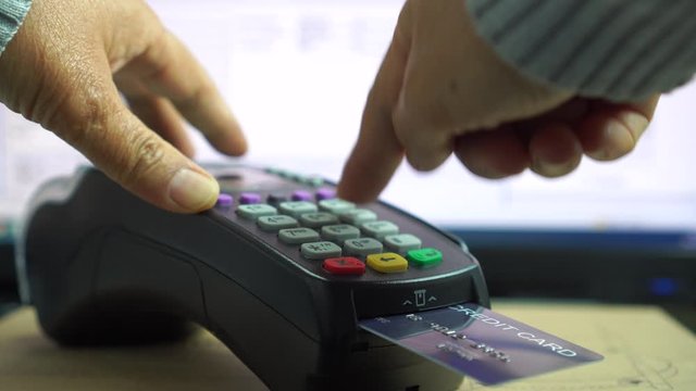 Credit card payment for purchase or sell products and service, business people hand pushing button or swipe to buy shopping through electronic transaction machine, Payments by credit card in terminal