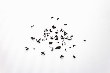 Dry wakame seaweed isolated on white background. Heap of dried kombu algae, traditional Japanese ingredient for cooking Dashi soup