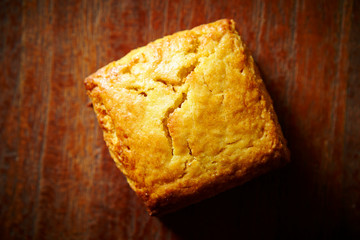 Plain scone on wooden background 