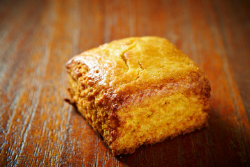 Plain scone on wooden background 