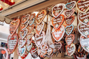 Gingerbread Hearts at the German Christmas Market. Traditional gingerbread with different inscriptions in German at a fair in Germany