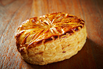 Sweet danish pie on wooden background 