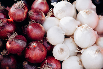 Lots of red and white onions. Background of red and white onions. Raw red and white onions
