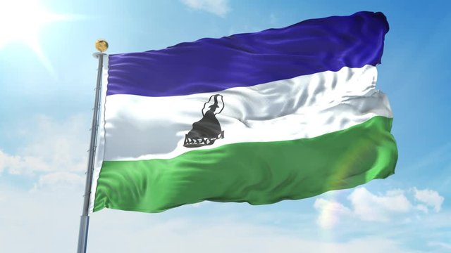 Lesotho flag waving in the wind against deep blue sky. National theme, international concept. 3D Render Seamless Loop 4K