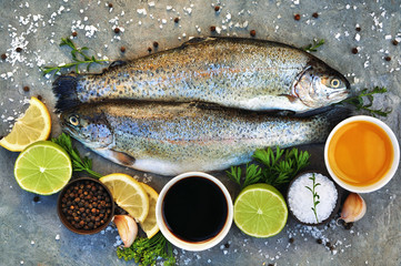 Fototapeta na wymiar Sea trout fresh fish from market, seafood diet cooking background