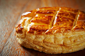 Sweet danish pie on wooden background 