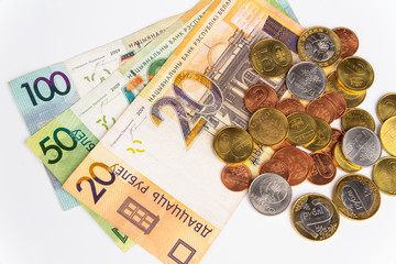 This is money, paper and coins of various denominations of the Republic of Belarus. Money on a white background.
