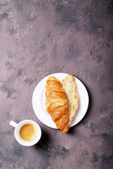 Fresh coffee with croissant