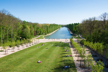 People relaxing in beautiful public park of Sceaux near Paris( France) in sunny spring day. People...