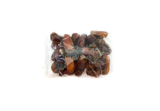 dates in a plastic bag on a white background.