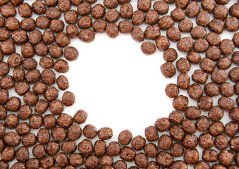 chocolate balls on white, dry breakfast. Place for text.