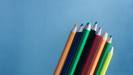 Color Pencils On A Blue Background For Drawing Graphics For Children And Adults. Colored Pencils Macro