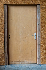 .provisional door and wall on a construction site