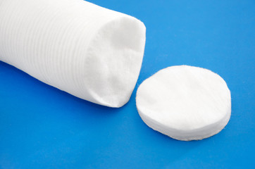 Cotton pads on a blue background. Close-up.