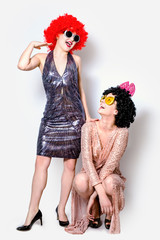 Attractive playful young women ready for carnival parties. Lifestyle and the concept of friendship:...