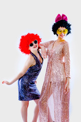 Attractive playful young women ready for carnival parties. Lifestyle and the concept of friendship:...