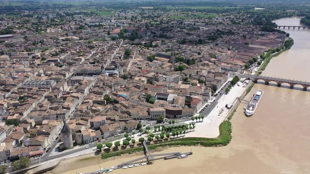 Panoramic aerial view of Libourne city on Dordogne river on sunny summer day, Gironde, France