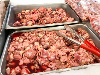 row of Giblets chicken in shelf store in food market