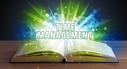 TIME MANAGEMENT inscription coming out from an open book, educational concept