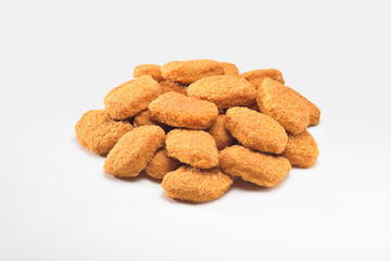 A portion of delicious and crispy chicken nuggets, isolated on white background. A popular fast food  made from chicken meat that is breaded or battered, then deep-fried or baked.